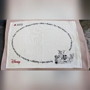 Disney+Red Cross White Pillowcase/Emergency Bag with Mickey and Friends design.